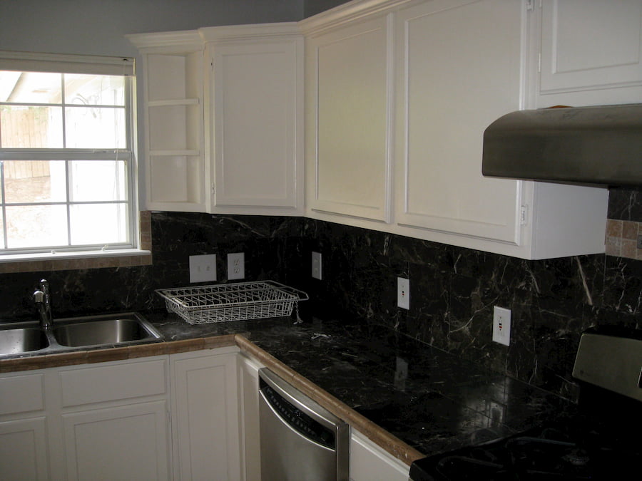 Kitchen and living in Lakeway before painting